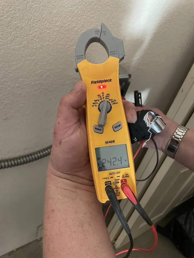 Voltage testing with clamp meter during Ceiling Fan Installation in Rossville